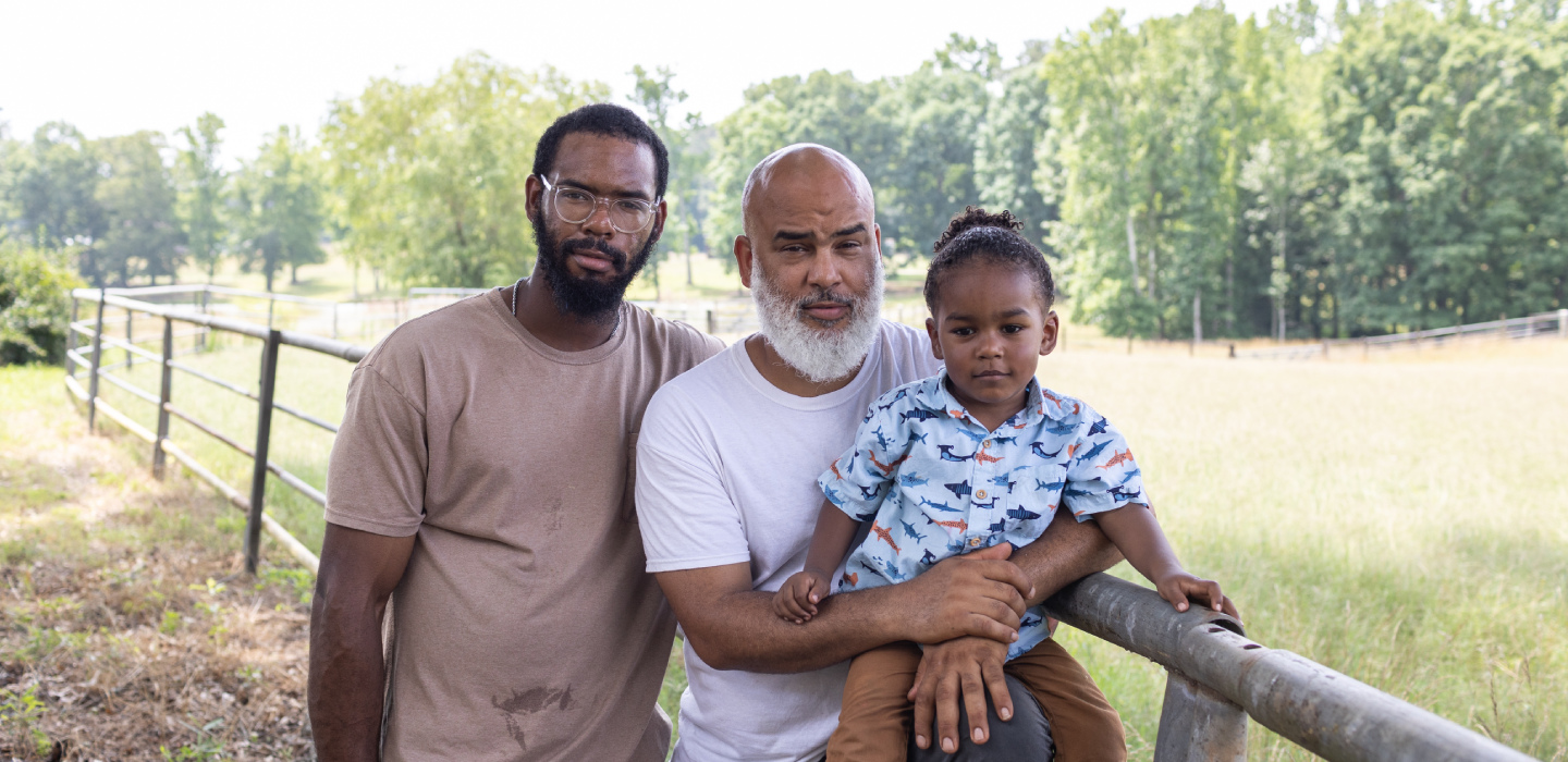 Three family generations pose on their working farm in Georgia