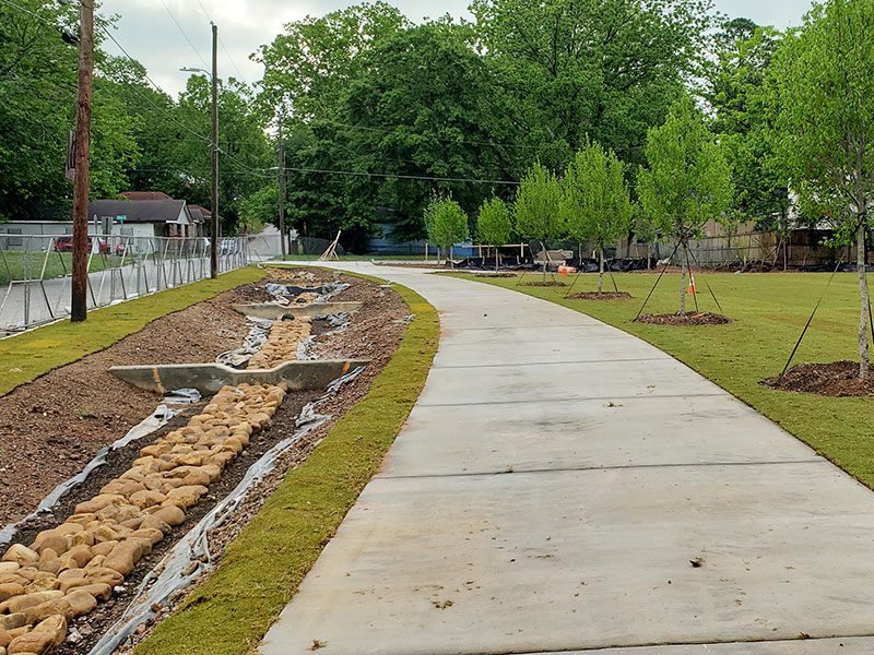 Rain gardens, constructed wetlands and other green infrastructure features will capture stormwater runoff from adjacent streets, reducing the negative impacts of flooding and improving water quality.