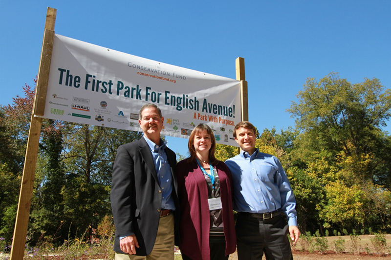 The Conservation Fund staff members (L to R): Andrew Shock, Shannon Lee, and Stacy Funderburke, proudly standing in front of the Lindsay Street Park sign at the ribbon cutting event.