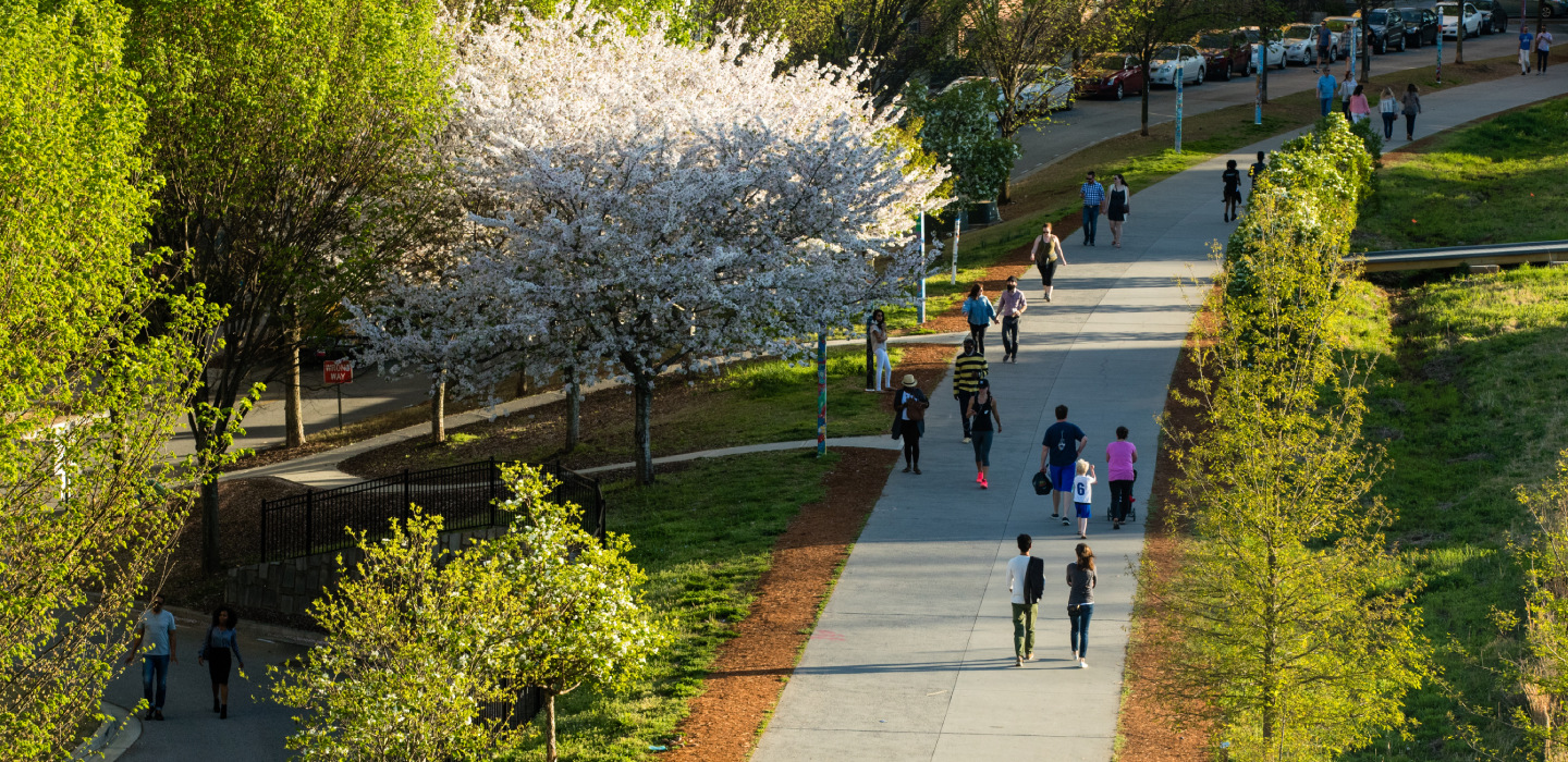 People walk the Atlanta Beltline on a spring day