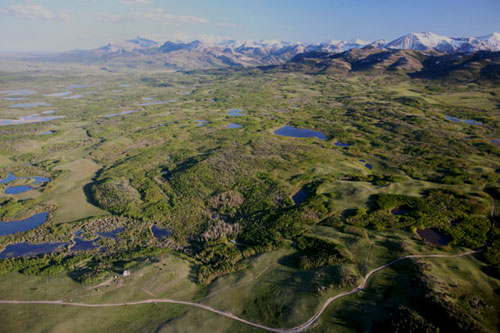 Aerial View Of The Front Photo by Todd Kaplan  Two centuries ago, Lewis and Clark journeyed across this area on their way West. Today, most of the sights and wildlife they encountered still endure. The Front is magnificent—but also at risk.