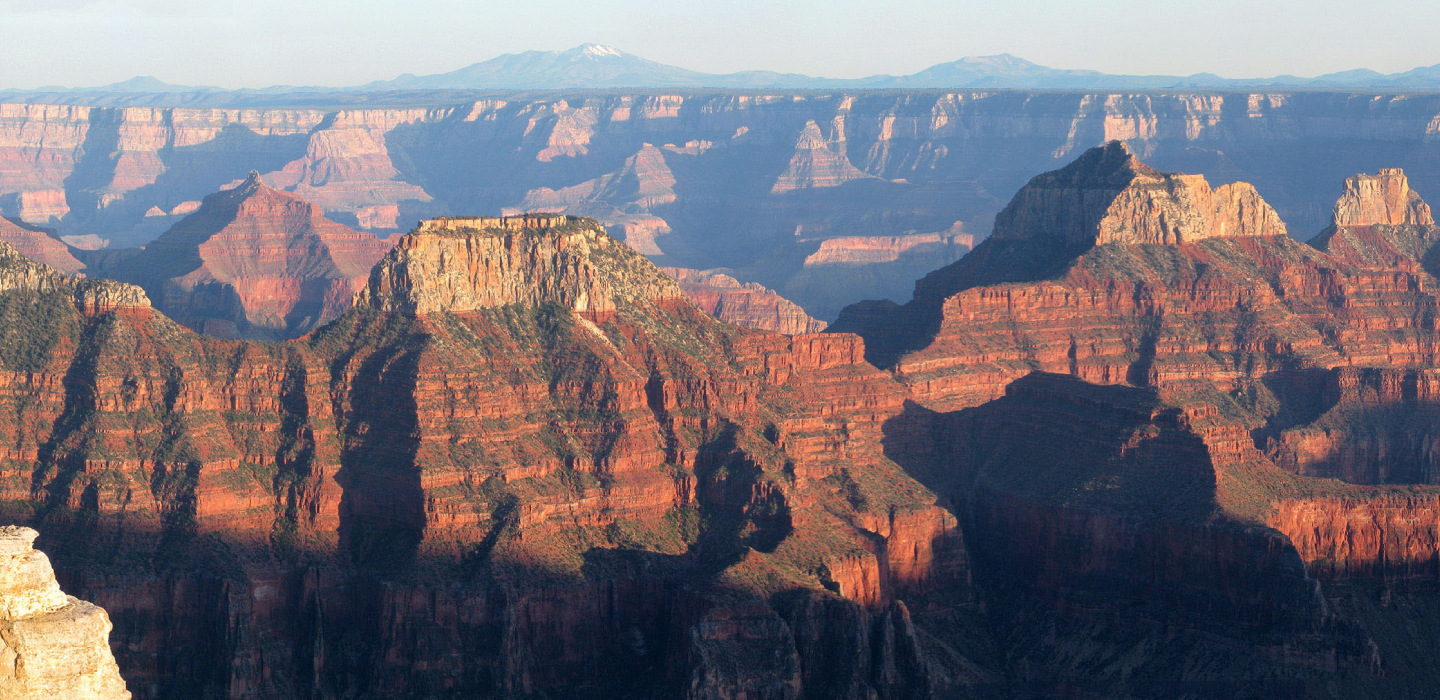 An aerial view of the north rim of Grand Canyon National Park as the sun slowly sets.