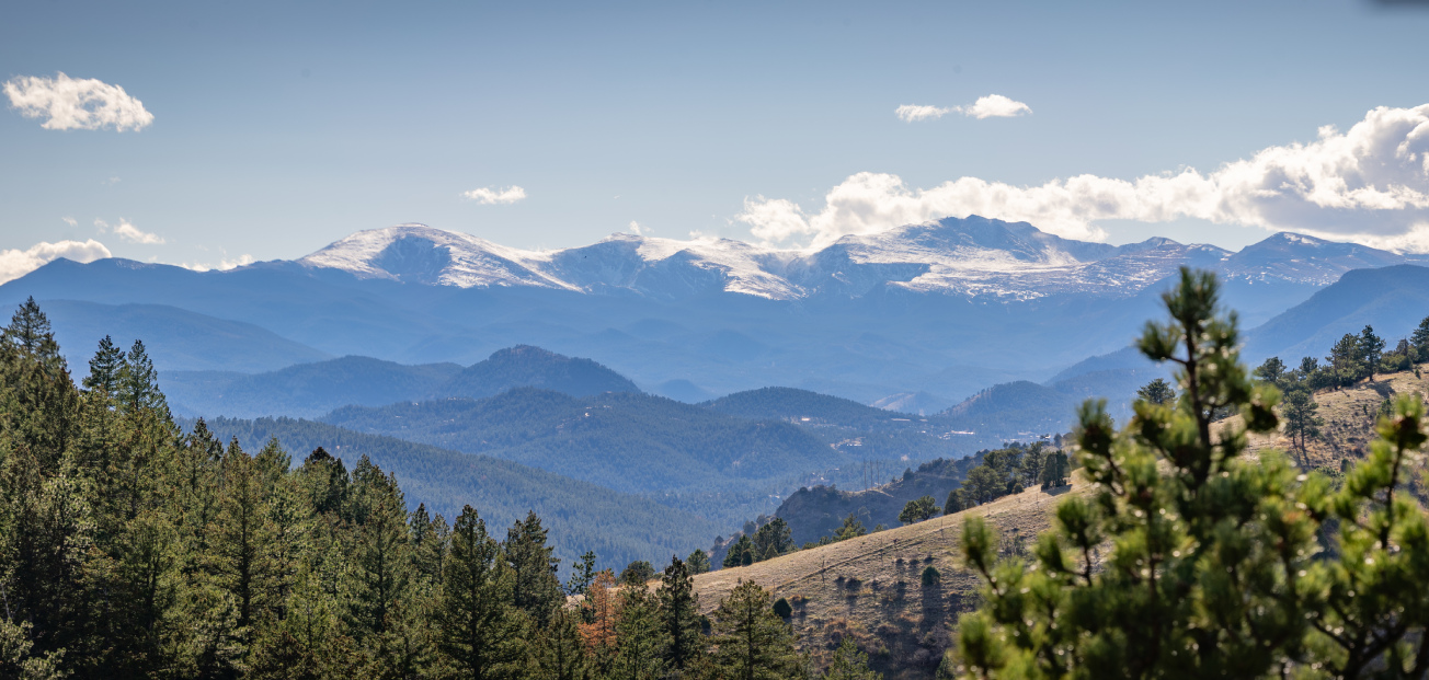 View of the mountains from a hillside at Braun Ranch, showcasing the Colorado Front Range